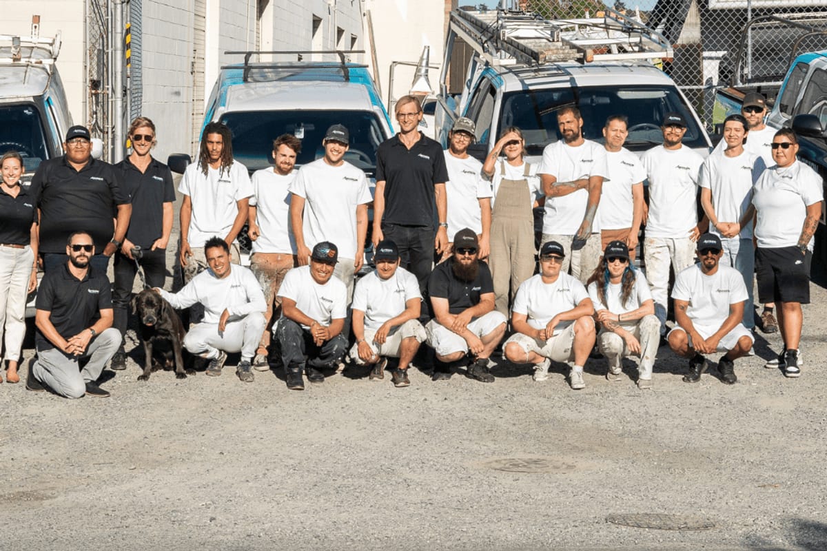 The Envision Painting team with their branded vans
